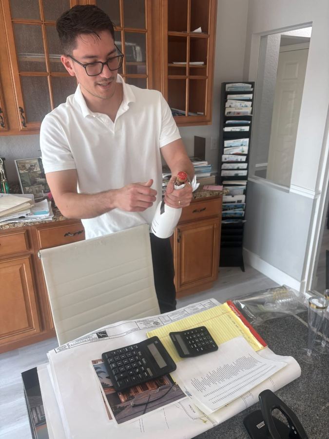 Marco opening champagne on closing day
