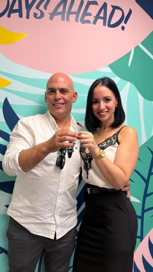 Couple holding up the keys to their new home